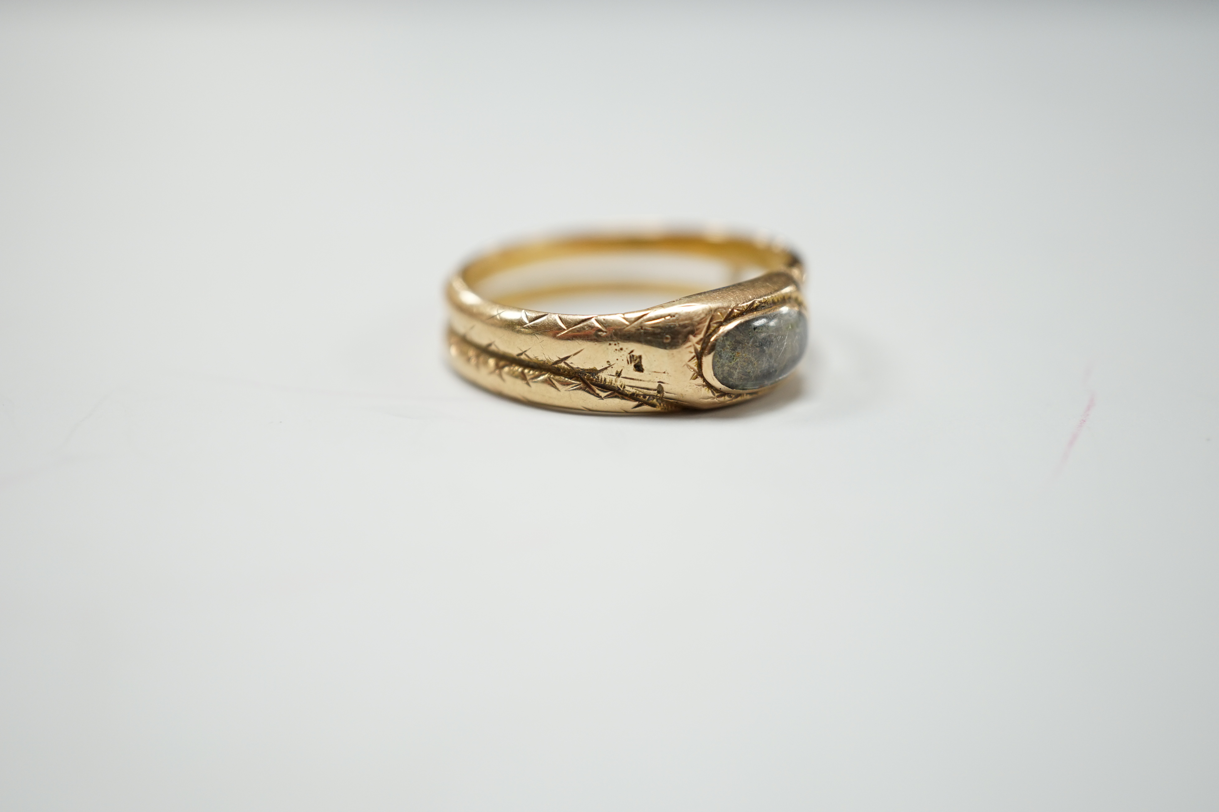 An early 19th century gold memorial ring, with small hairwork panel and inscription for Mary Goodwyn, Obt.30 Nov 1816 Aet 85, size N, gross 3.2 grams